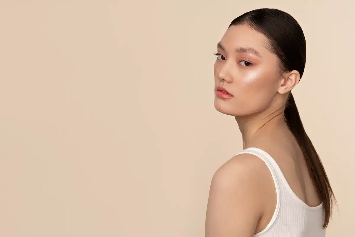 Side view korean woman posing in studio