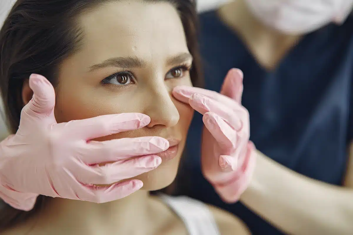 Woman with a doctor in cosmetology studio